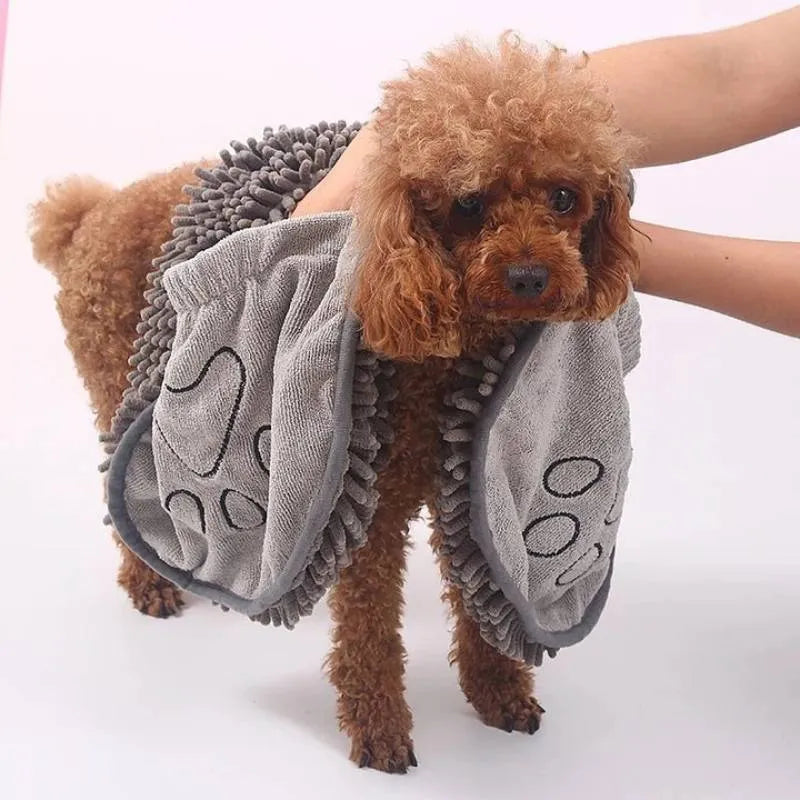 Blue dog bath robe towel laid flat showing 62cm by 23cm size and soft fibre texture