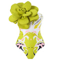 Blue one-piece swimsuit with matching sheer gauze cover-up skirt laid flat.