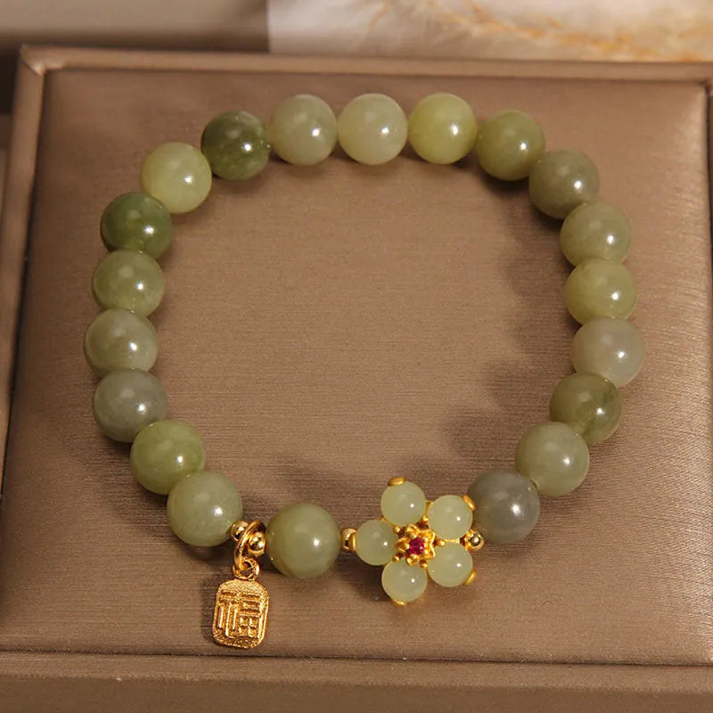 A grey jade coloured alloy bracelet for women in a casual style.