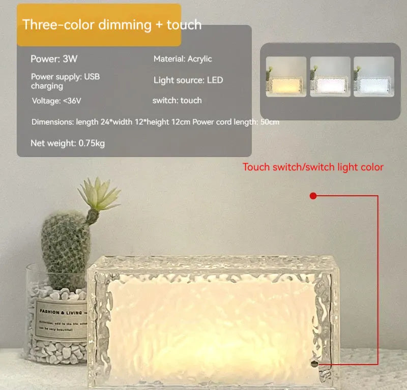 Geometric clear acrylic ice cube shaped night lamp with coloured LED light inside on a wooden table.