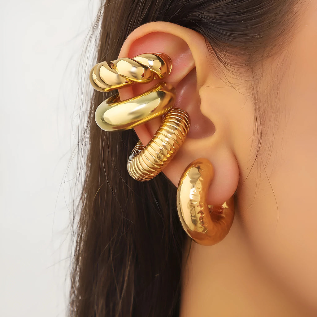 Set of four geometric gold and silver clip-on earrings for women without pierced ears.