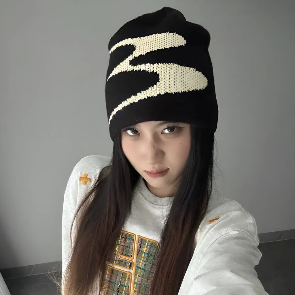 A knitted acrylic beanie hat in medium size, shown in black, grey, and white colour options.
