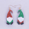 A pair of colourful Santa Claus cartoon character earrings made from acrylic, showing red and green hat style options.