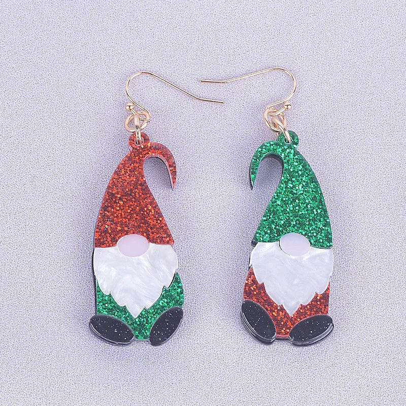 A pair of colourful Santa Claus cartoon character earrings made from acrylic, showing red and green hat style options.