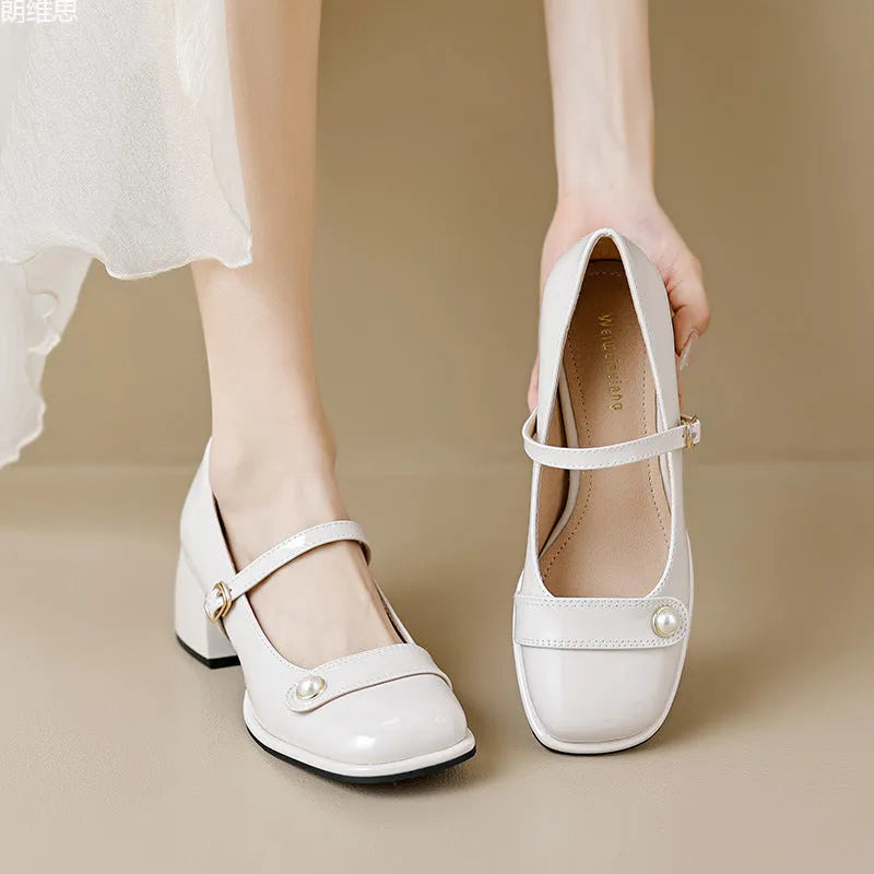 French style hiking boots with patent leather upper, chunky block heel, and buckle fastening in apricot colour