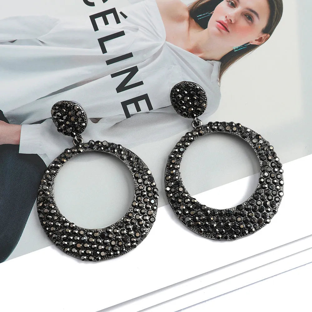 Large round metal alloy pendant earrings with colourful cartoon style design