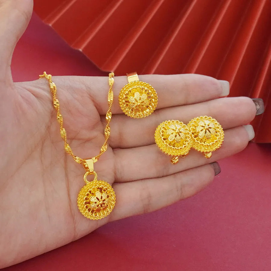 Landscape Middle East gold-plated floral jewellery set showing necklace, earrings and ring with electroplated finish