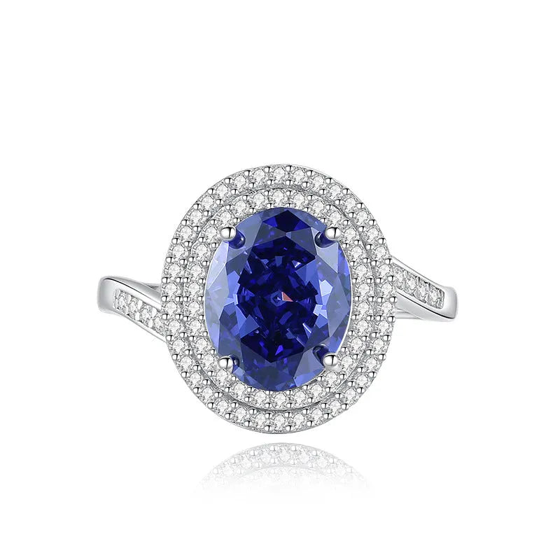 Heart-shaped sterling silver ring with a faceted ice flower cut zircon stone in a Tanzanite colour.