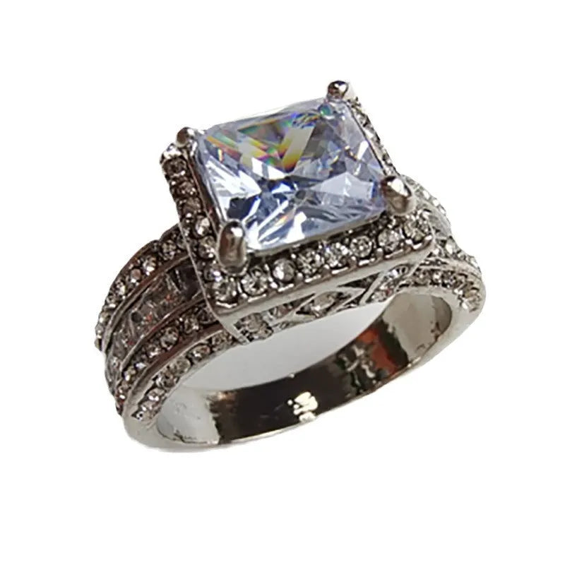 Geometric alloy fashion ring in gold or white colour on size display showing UK sizes 5-13