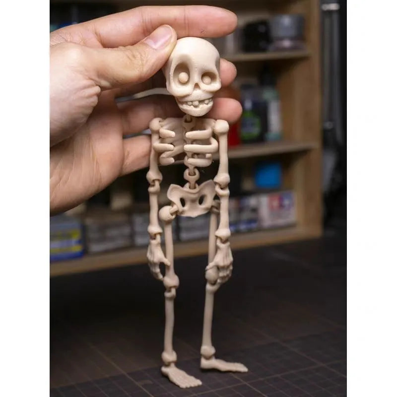 3D printed Halloween skull ornament in multiple colours displayed as fridge magnet