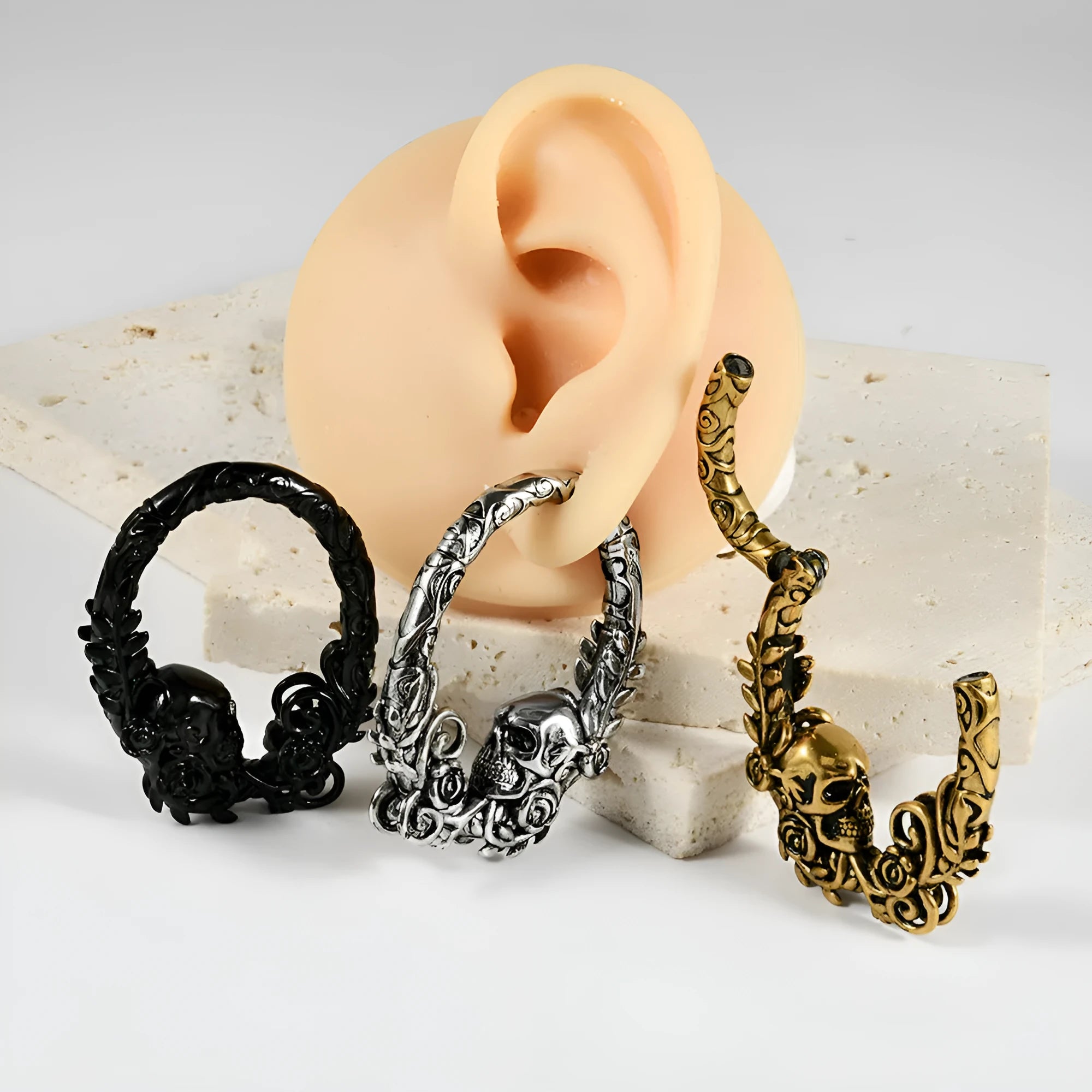 A pair of silver totem pattern fashion earrings made from stainless steel with an electroplated finish.