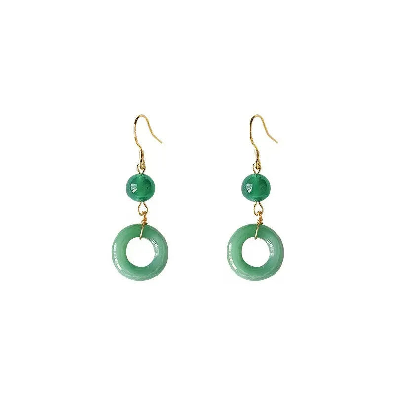 Pair of green jade design earrings with a geometric peace buckle shape on a zinc alloy base with gold plating.