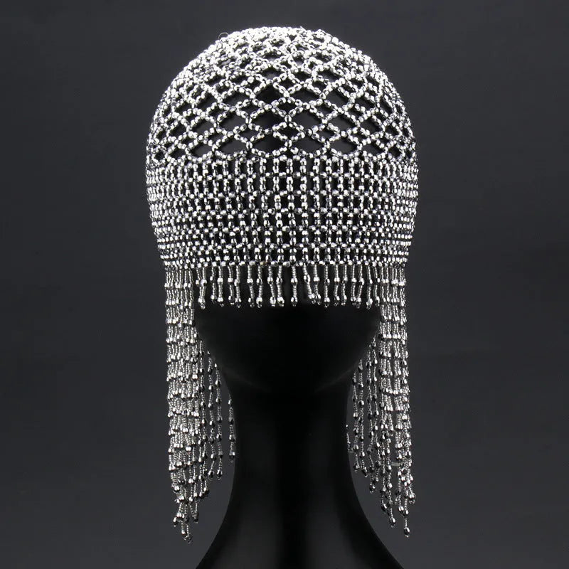Handmade alloy belly dance hat with tassels and decorative mesh panels.