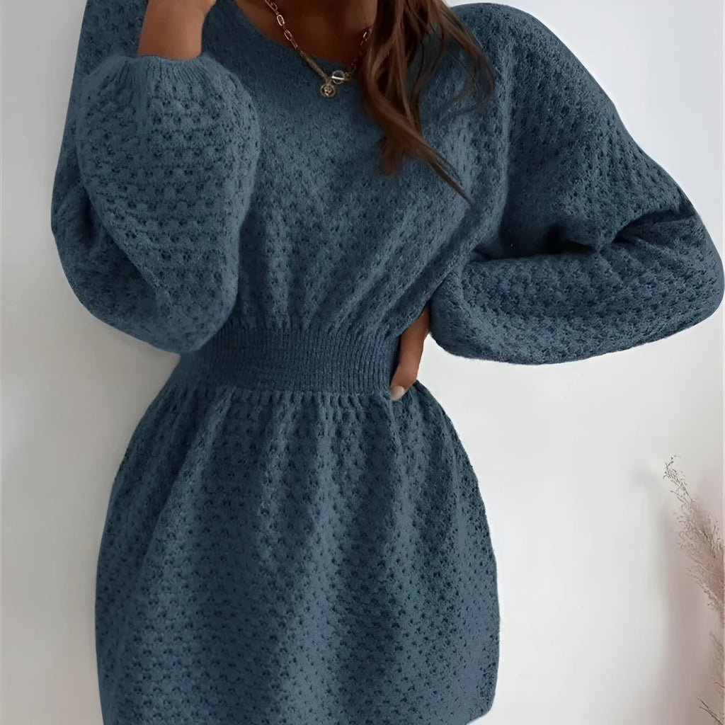 Blue women's knitted dress with hand-crocheted flower embellishments and fitted waist design