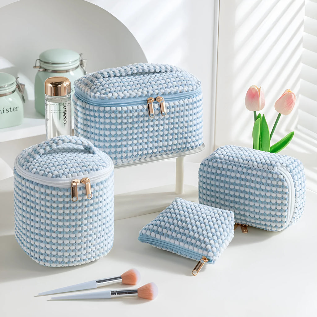 Four cube-style flannelette makeup bags in different colours: pink, khaki, pink dots, and blue with dots