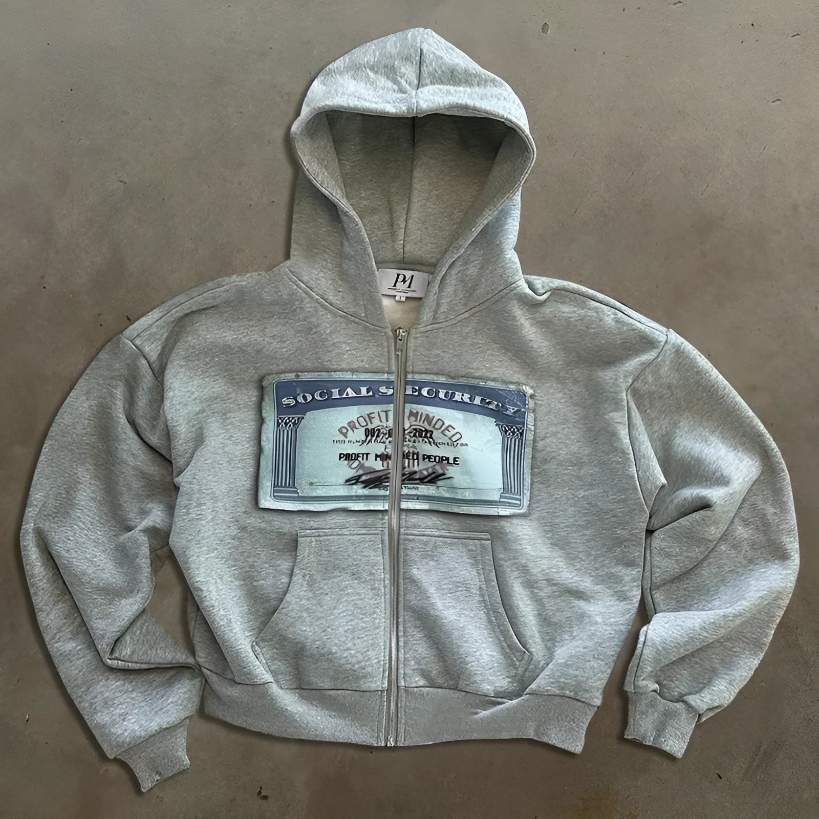 Unisex loose fit hoodie jacket with zipper closure in black, grey or pink polyester fabric