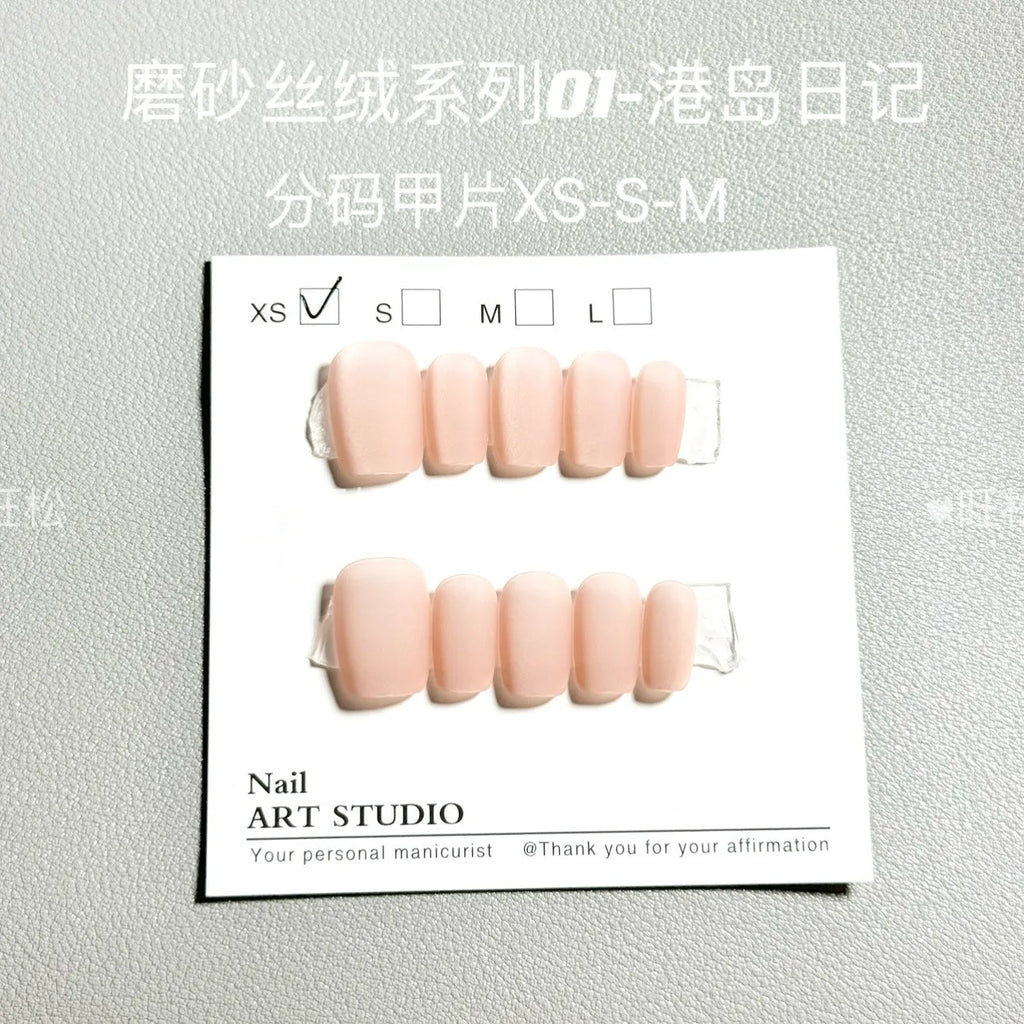 Set of frosted velvet Cat's Eye nail art wraps showing aurora and solid colour designs on short ladder sizes.