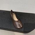 Women's black chunky heel pumps with split toe horseshoe design and round toe