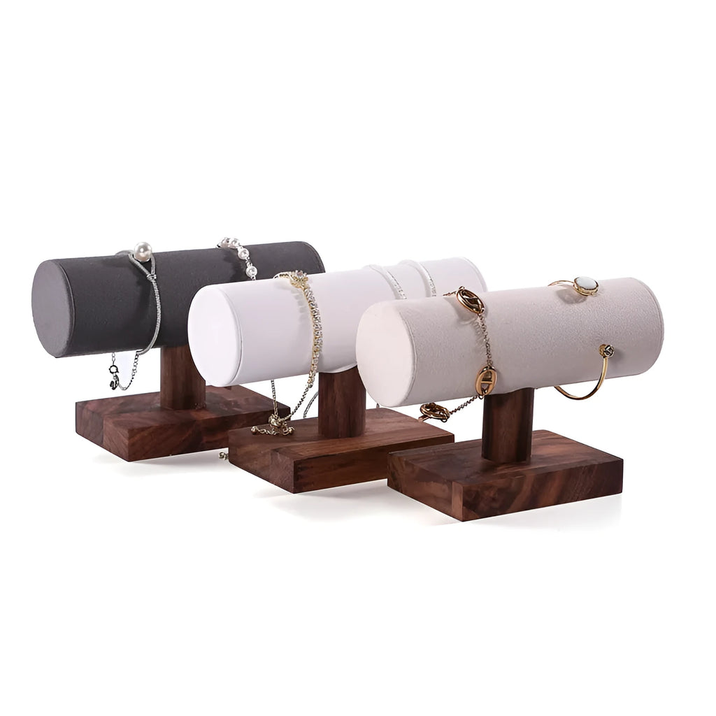 Walnut bracelet display stand with I-shaped solid wood frame and short cylinder, shown in beige velvet, dark grey, or white leather.
