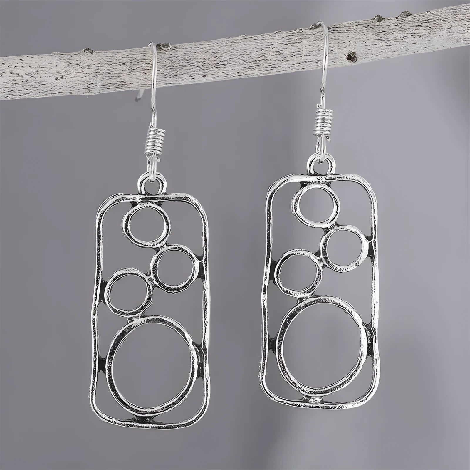 Geometric ring earrings in antique silver colour with irregular square and round shapes