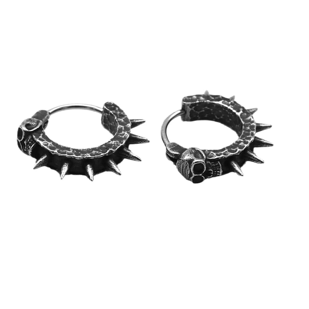 A pair of black alloy punk-style earrings shaped like geometric motorcycles.
