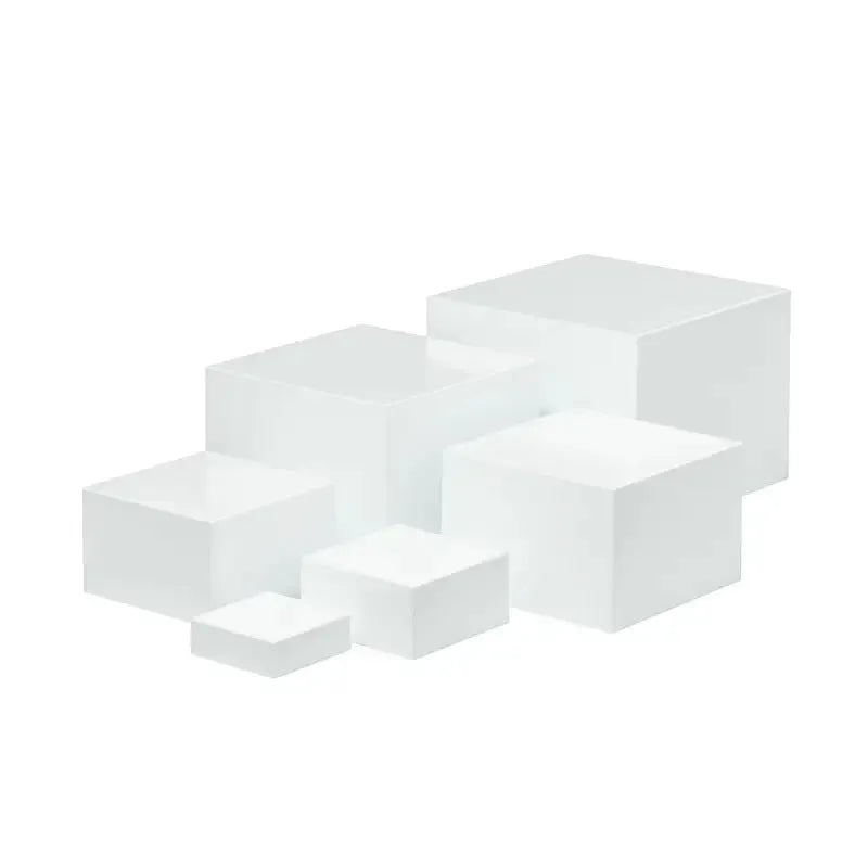 White plastic modular cube dessert display stand with six stackable units for cakes and pastries