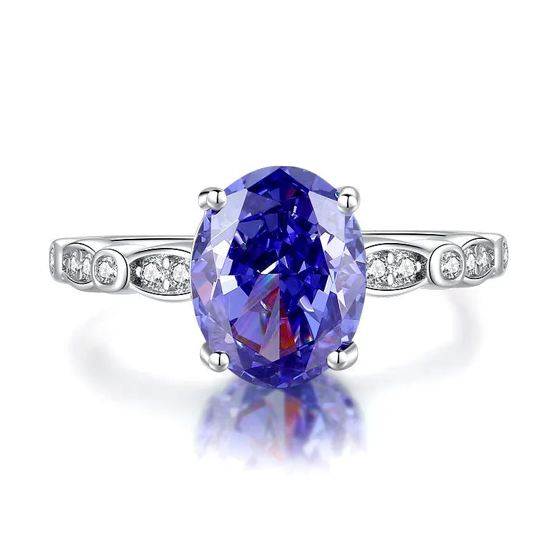 Heart-shaped sterling silver ring with a faceted ice flower cut zircon stone in a Tanzanite colour.
