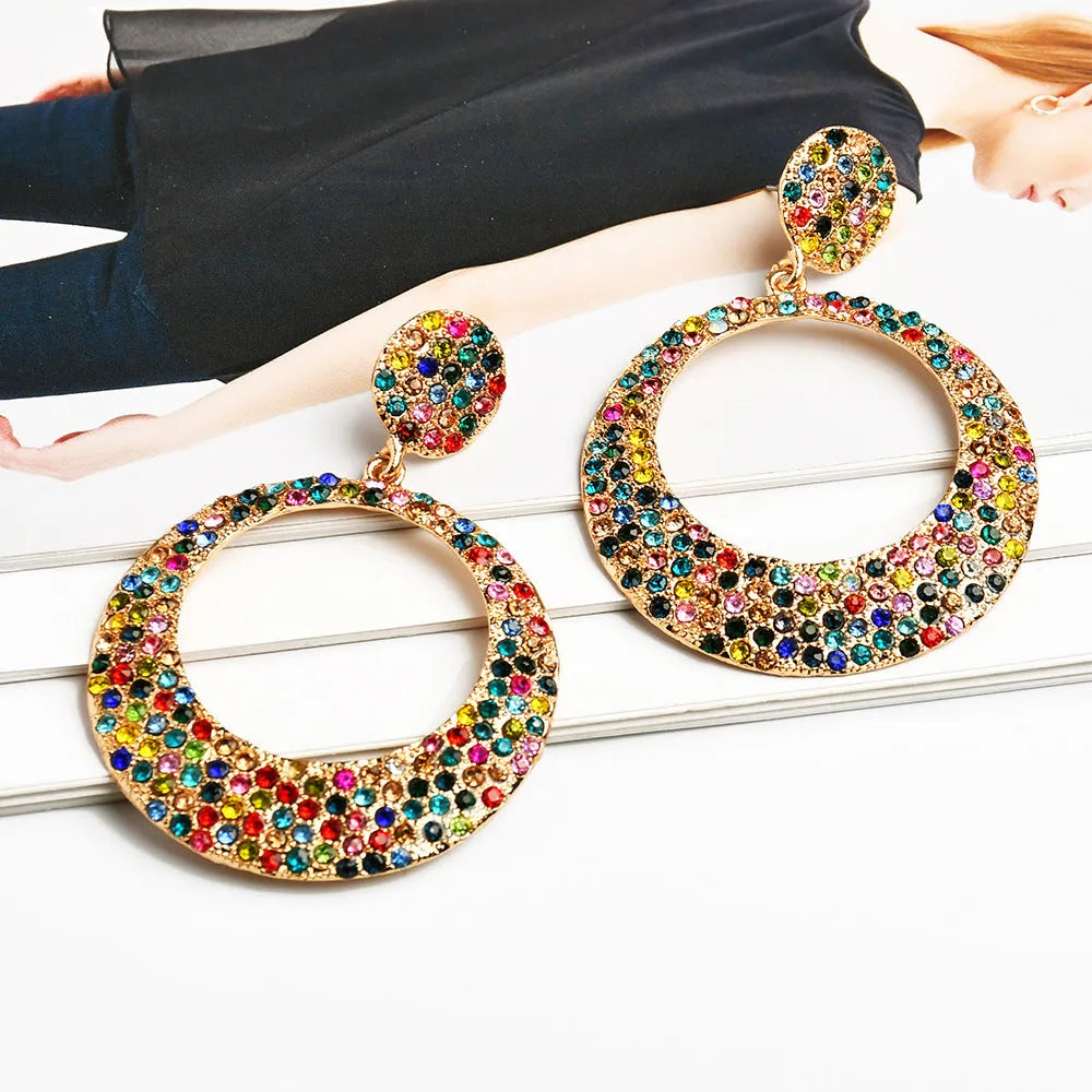 Large round metal alloy pendant earrings with colourful cartoon style design