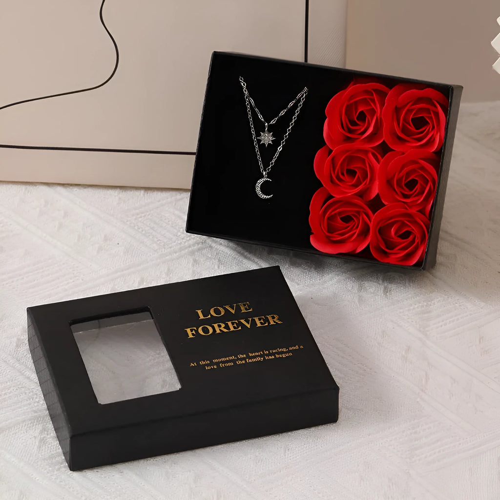 Six scented soap flowers in red pink or black inside a gift box with matching handbag