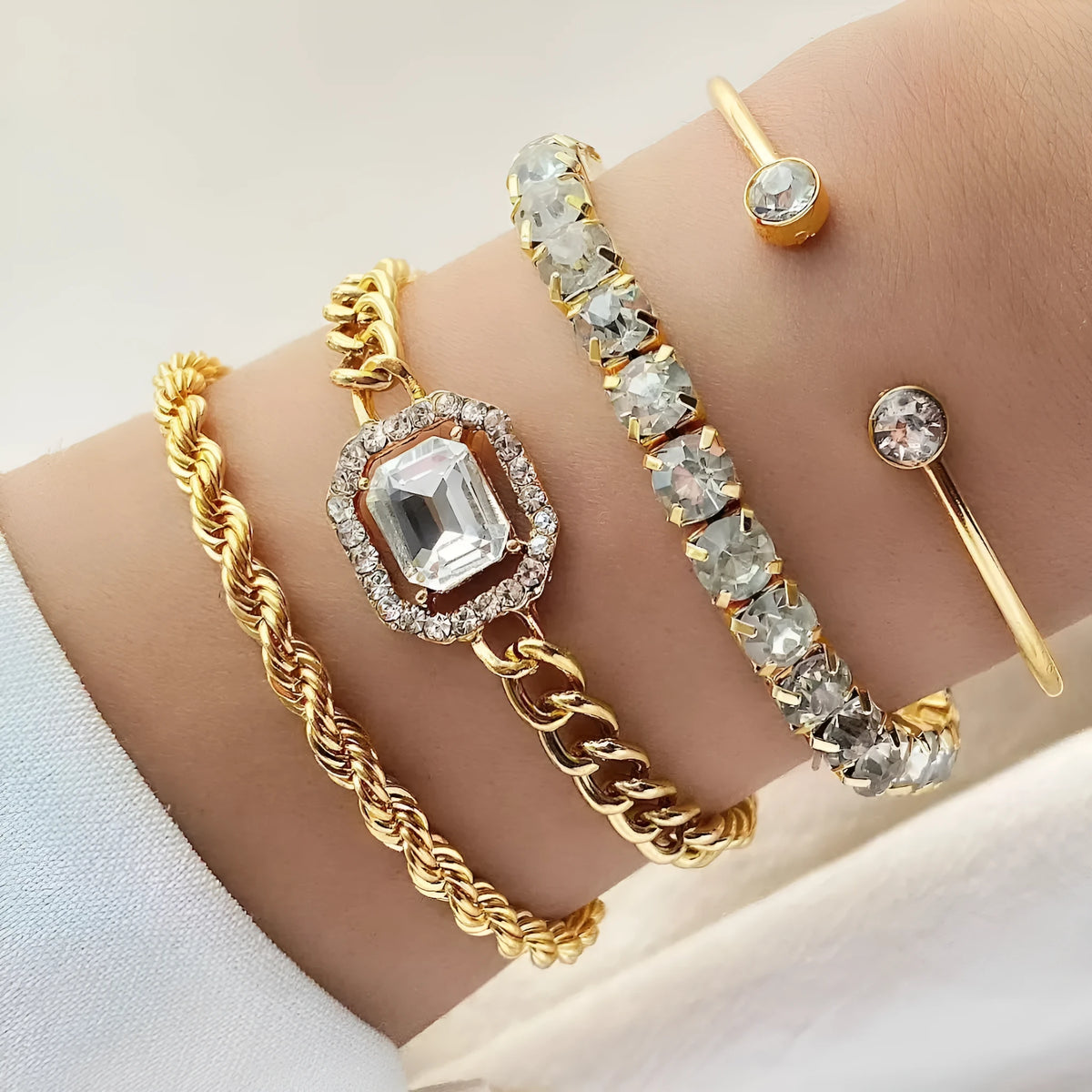 Four-piece geometric retro bracelet set with square diamond design in gold finish