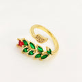 Copper geometric open ring with gold zircon plating and micro-inlaid leaf design, shown in two colours.