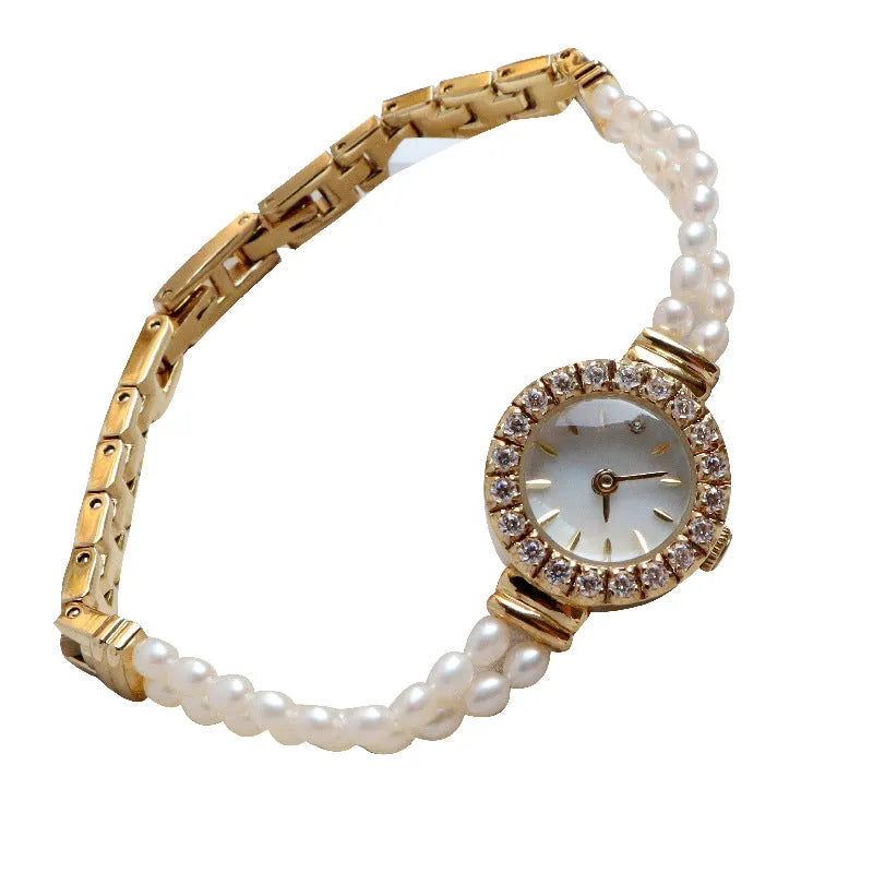 Women's light gold freshwater pearl bracelet watch with round dial on stainless steel strap