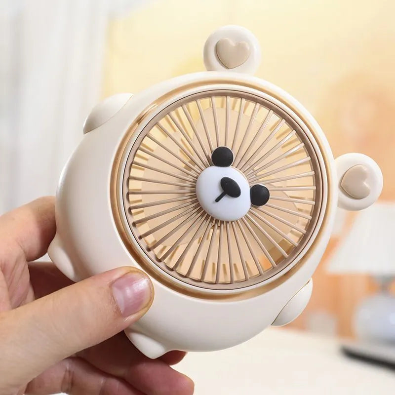 A Bear Brown coloured desktop USB electric fan for dogs on a wooden table.