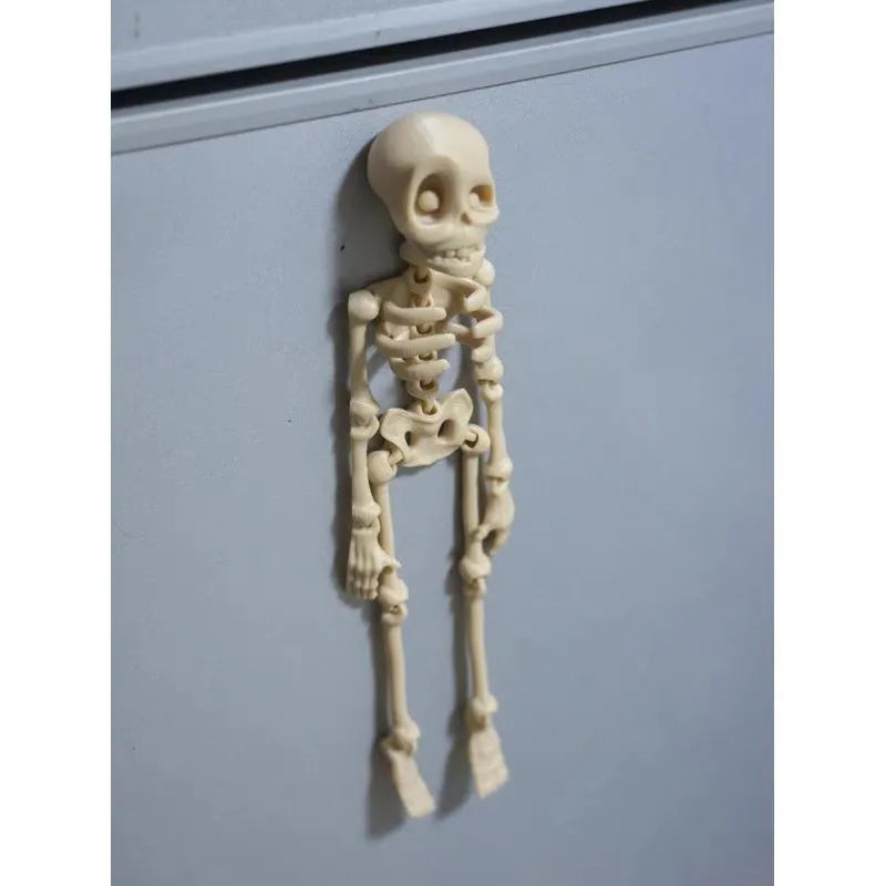 3D printed Halloween skull ornament in multiple colours displayed as fridge magnet