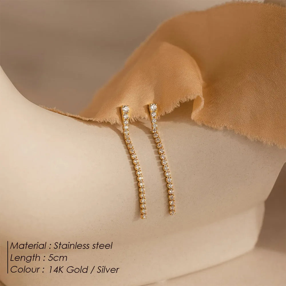 A pair of women's geometric stainless steel earrings with zircon detail in gold and steel colour options.