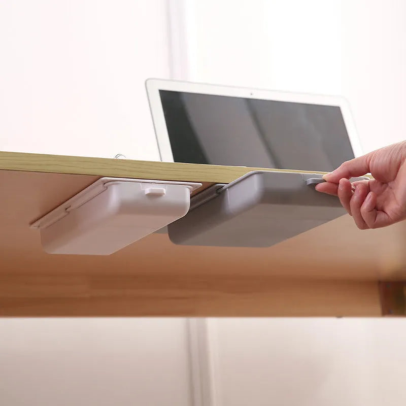 Adhesive under-table plastic storage box with covered lid and internal grid organisation