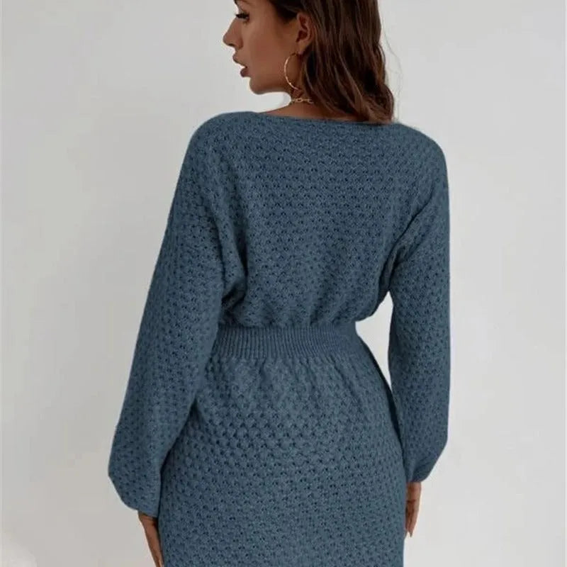 Blue women's knitted dress with hand-crocheted flower embellishments and fitted waist design