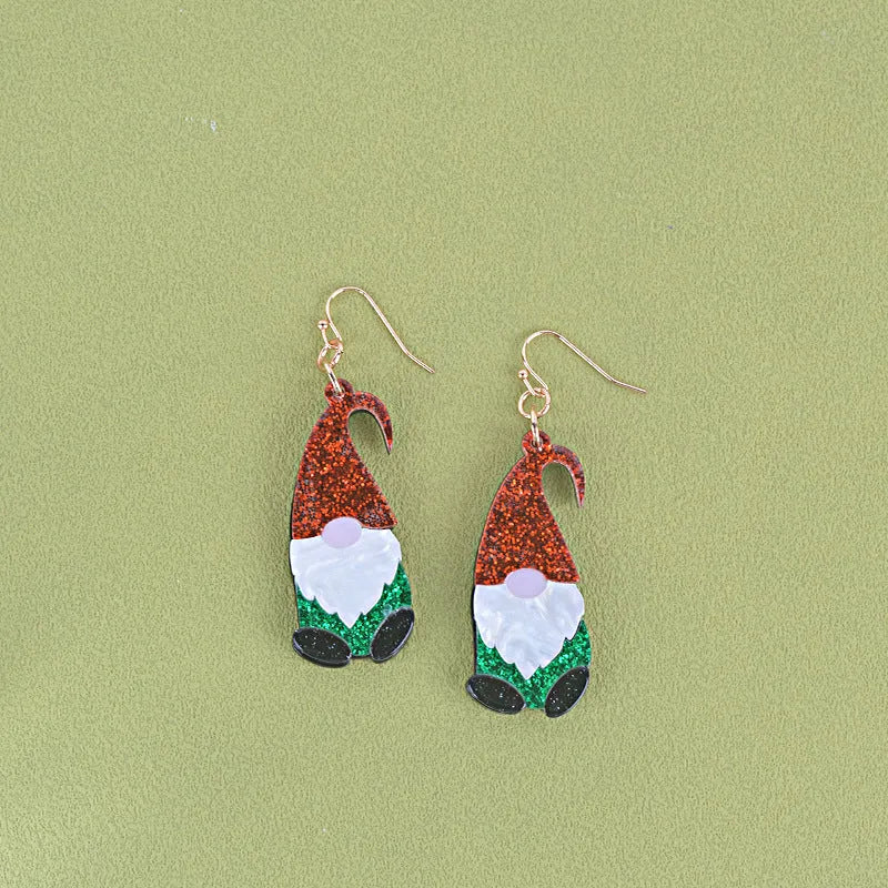 A pair of colourful Santa Claus cartoon character earrings made from acrylic, showing red and green hat style options.