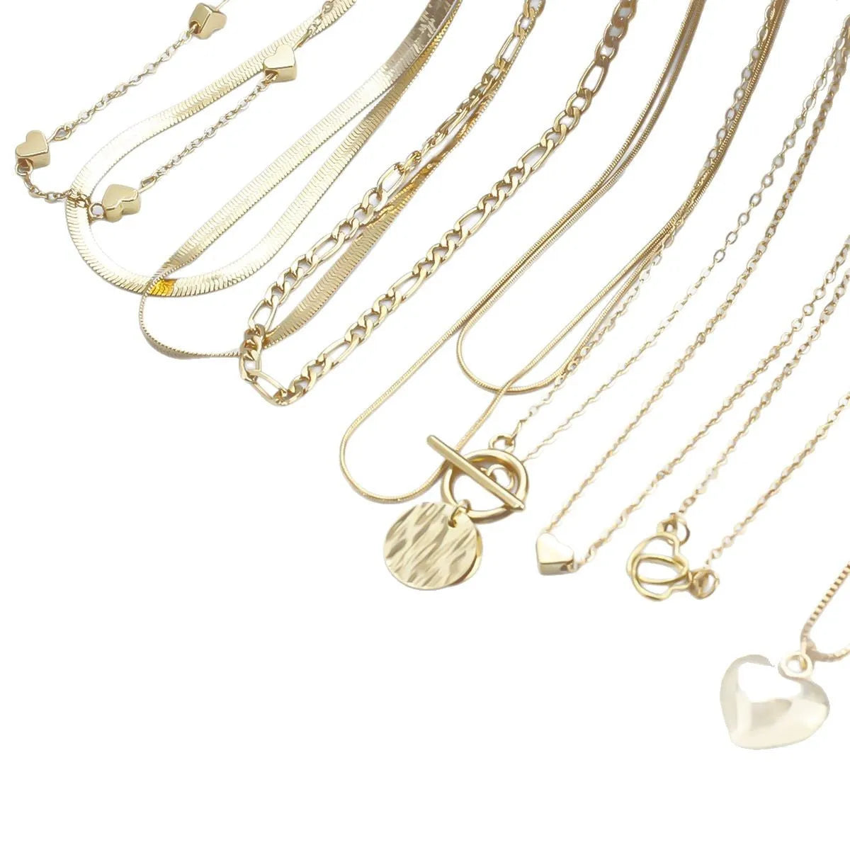 Ten gold-coloured women's necklaces with different alloy pendants on snake bone chains