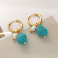 Geometric turquoise and cultured pearl ear clip set with irregular design in short and dangle styles