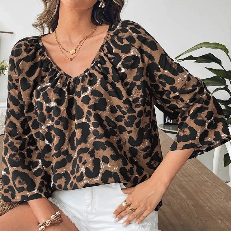 Leopard print women's pullover top with V-neck collar and pleated half sleeves in multicolour pattern