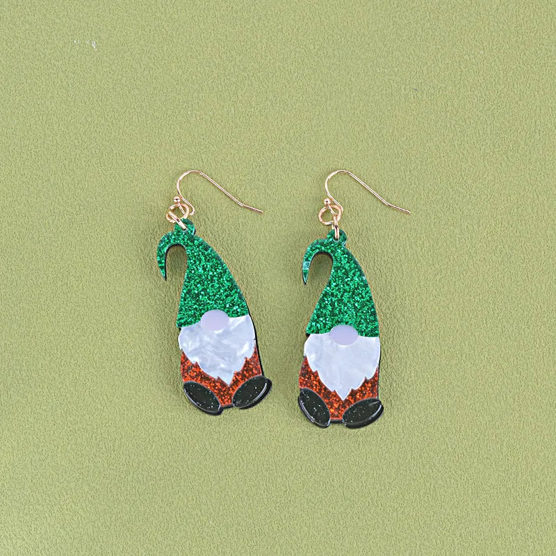 A pair of colourful Santa Claus cartoon character earrings made from acrylic, showing red and green hat style options.