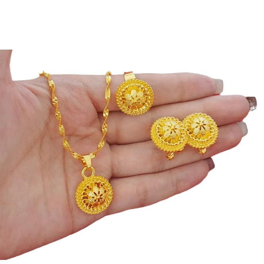 Landscape Middle East gold-plated floral jewellery set showing necklace, earrings and ring with electroplated finish