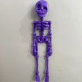 3D printed Halloween skull ornament in multiple colours displayed as fridge magnet