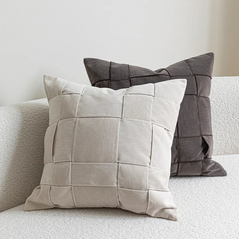 50x50cm square woven chenille pillow cushion on a sofa, shown in a beige colour option.