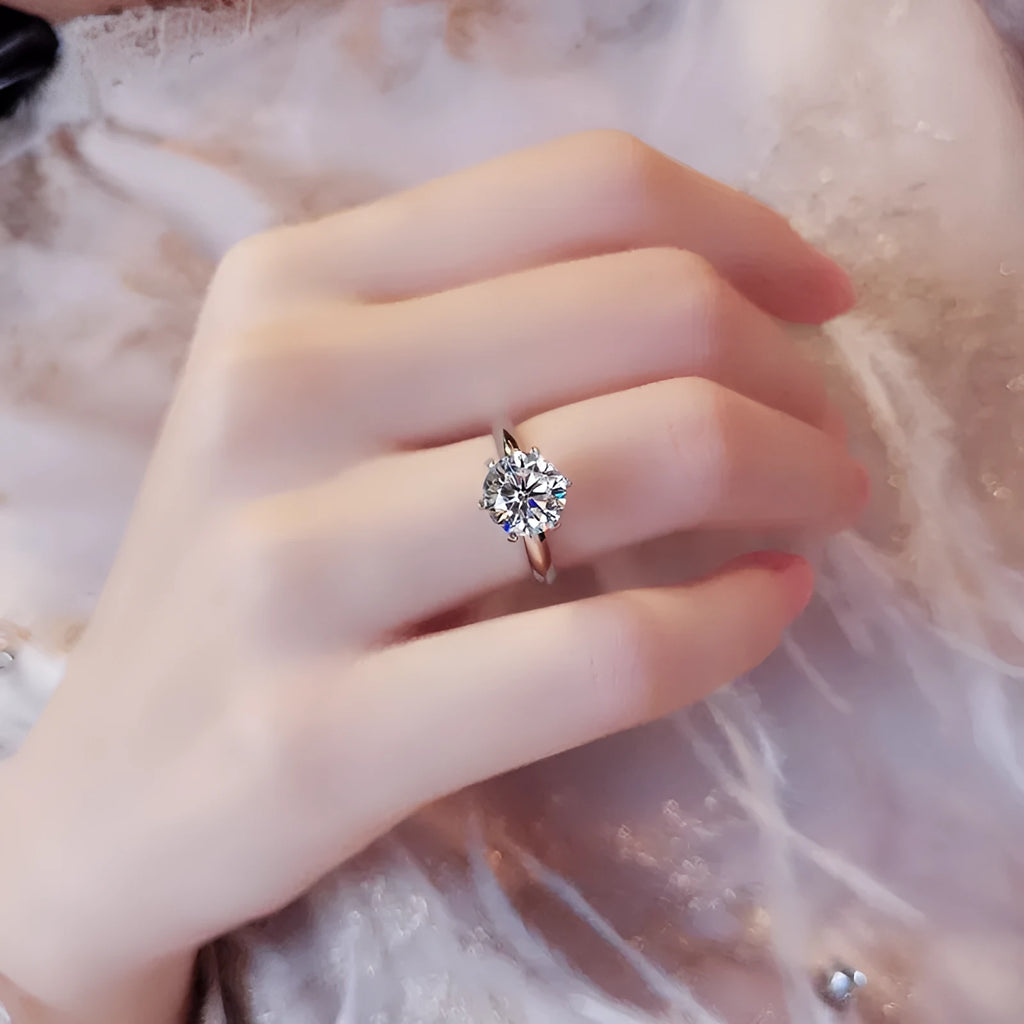 Six-claw set zircon ring with geometric design and white gold plated finish on white copper