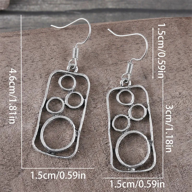 Geometric ring earrings in antique silver colour with irregular square and round shapes