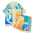 Plaid print beach outfit set for men and women, featuring a short sleeve shirt and matching trousers on a hanger.