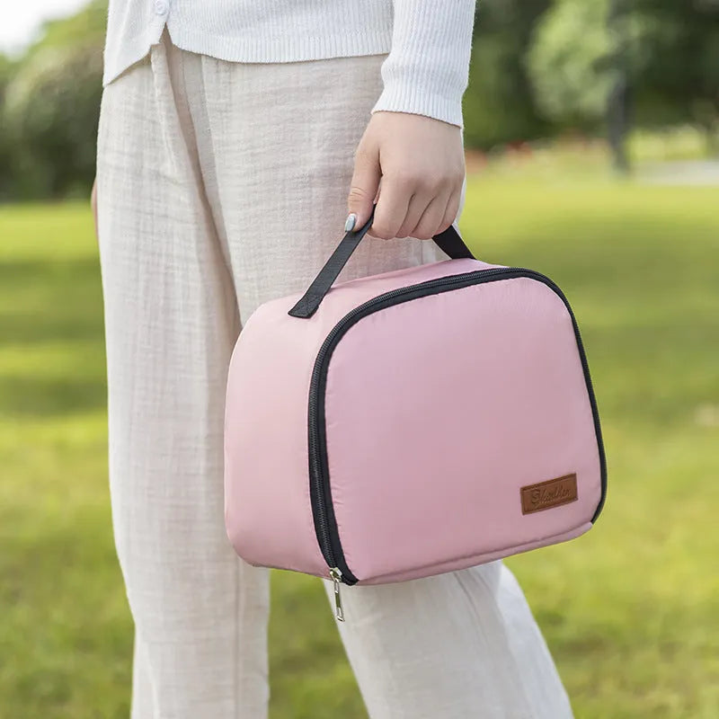 Large insulated lunch box bag in textured cloth, shown in blue colour with a bento box inside.