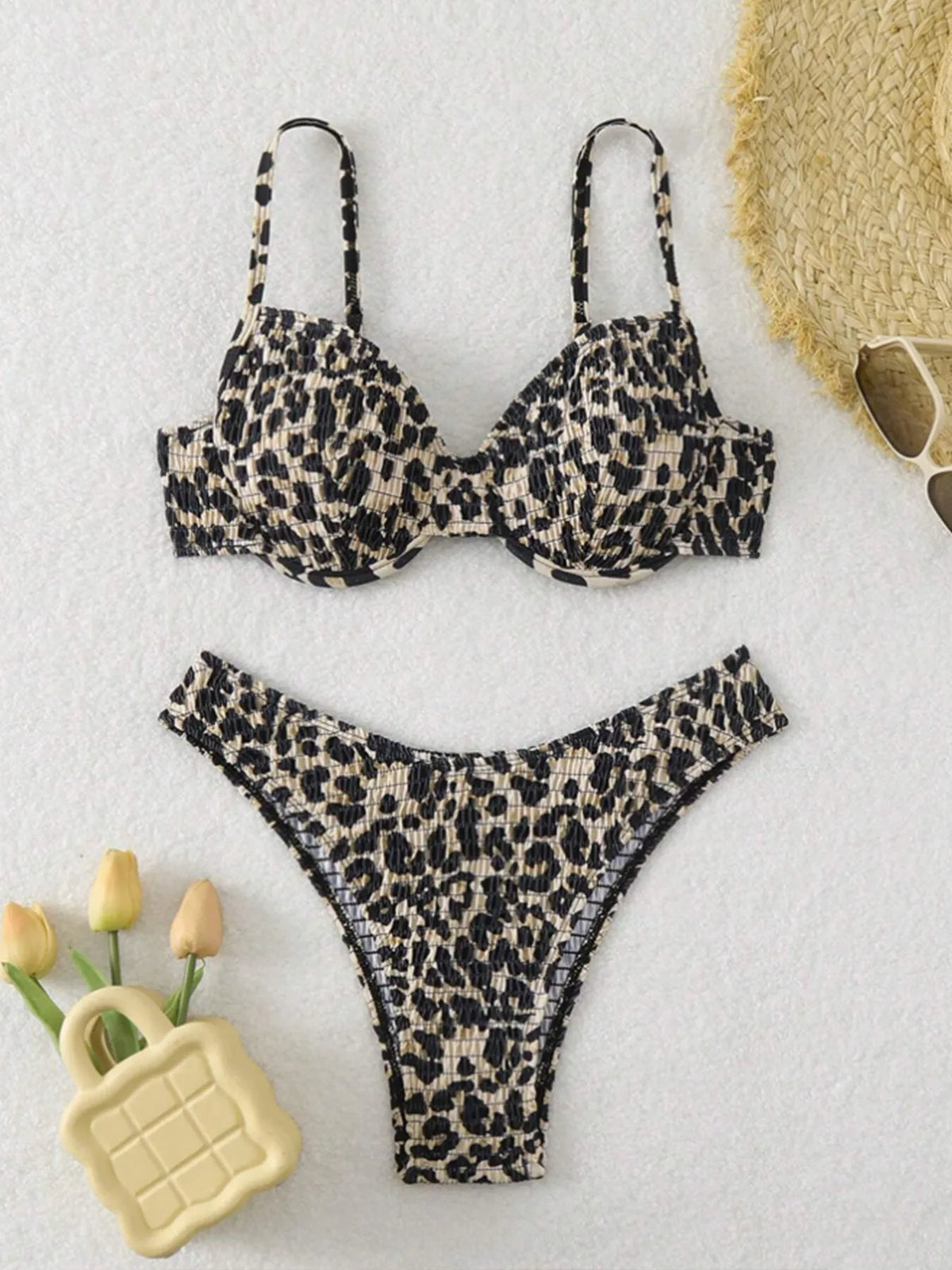 Women's leopard print bikini swimsuit with backless design in brown and red colour options.